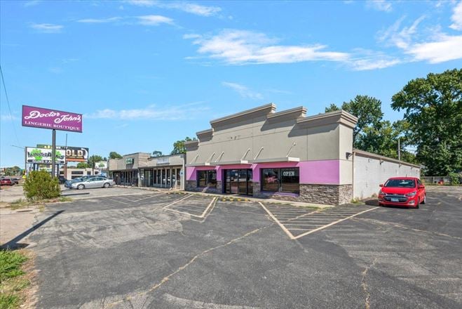 Retail Property with Open Showroom Near Hy-Vee For Sale