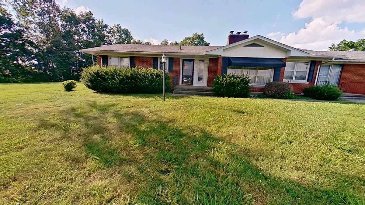 All-Brick Ranch Oasis on 4.09 Acres with Commercial Upside