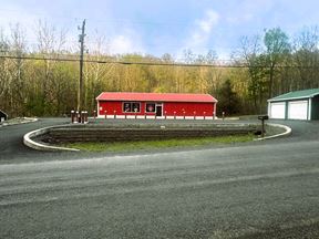 Mixed-Use Opportunity: Rented Storage Units + Large Main Building