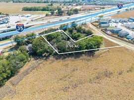 0.96 AC on I-35 South Frontage, Zoned C-3R / I-1, 1,960 SF Building