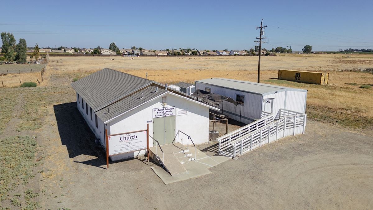 Church building with Modular home and 2 Sheds perfect for storage!