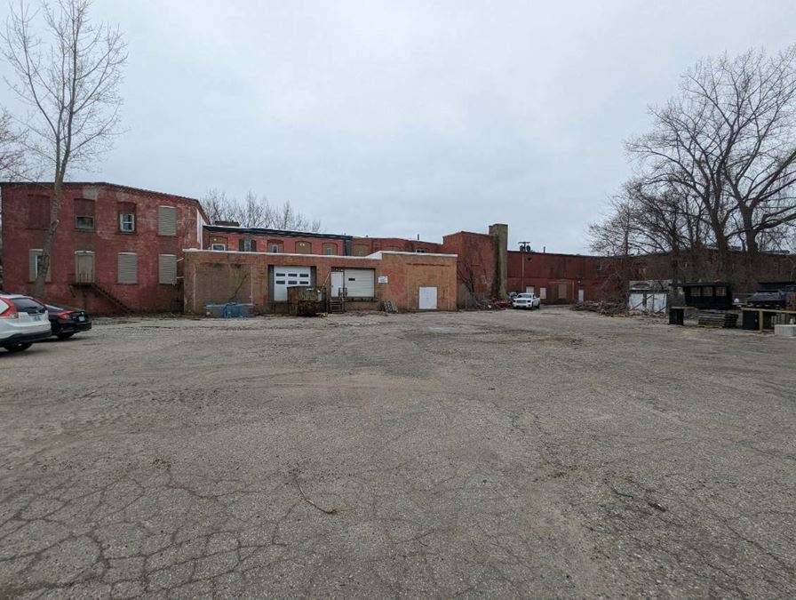 50,000 SF Industrial Building with a 2 family house and a lot.