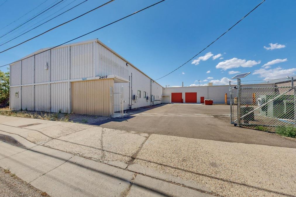 Newly Updated Clearspan Warehouse with Gated & Paved Yard near Big I