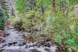 Water & Stone Cabins | 14-Keys | C-3 Zoning | Live Creek Frontage | 6.7 CAP