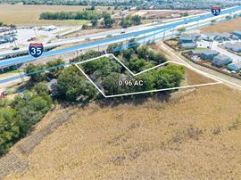 0.96 AC on I-35 South Frontage, Zoned C-3R / I-1, 1,960 SF Building