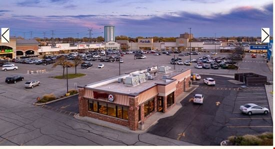 Four Flags Shopping Center - 8309 W Golf Rd