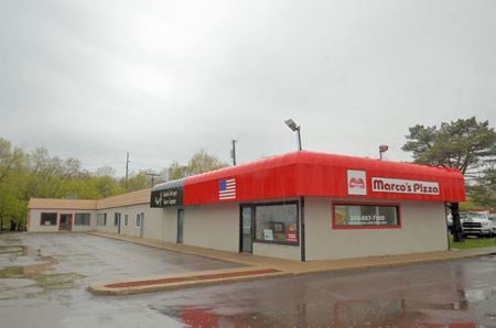 Commercial building on M59 west of Duck Lake Road - Highland
