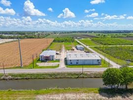 Dual Warehouses Near Hwy 90 with Surplus Land and Office