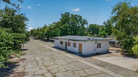 ±1,248 SF Freestanding Building + Paved/ Fenced Yard Storage Opportunity Near CA-99