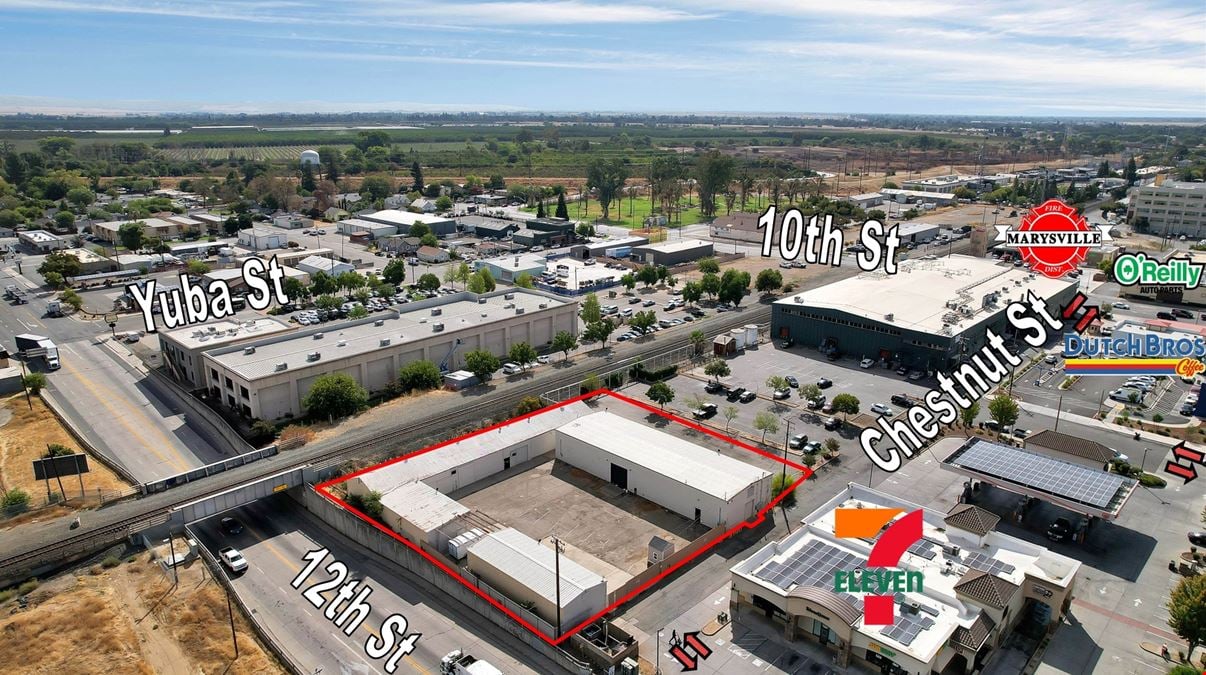 ±11,500 SF Of Clear Span Industrial Buildings + Fenced Lot