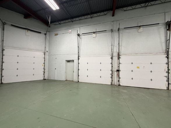 Load under roof: the truck pulls inside the building