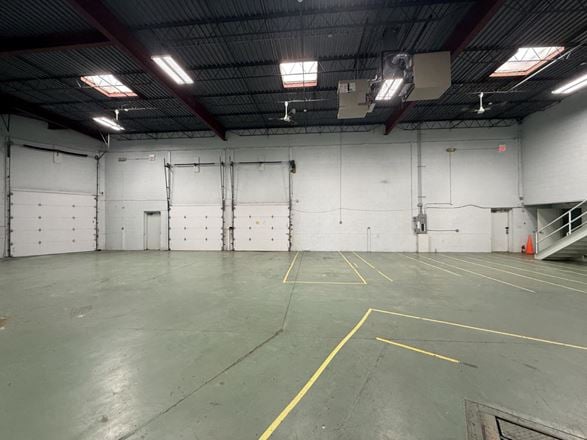 Load under roof: the truck pulls inside the building