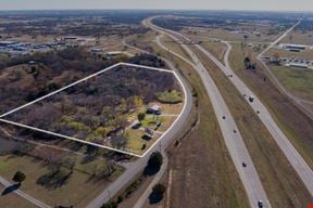 $1 Auction: Retail Storefront with Advertising Billboard off I-35