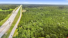 Prime Interstate-Frontage Commercial Tract – ±8.8 Acres with 3 Income Producing Building
