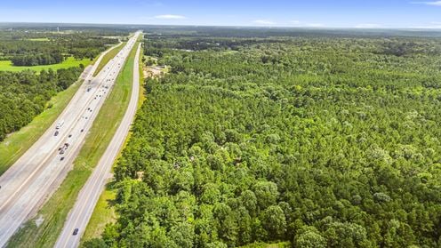 Prime Interstate-Frontage Commercial Tract – ±8.8 Acres with 3 Income Producing Building